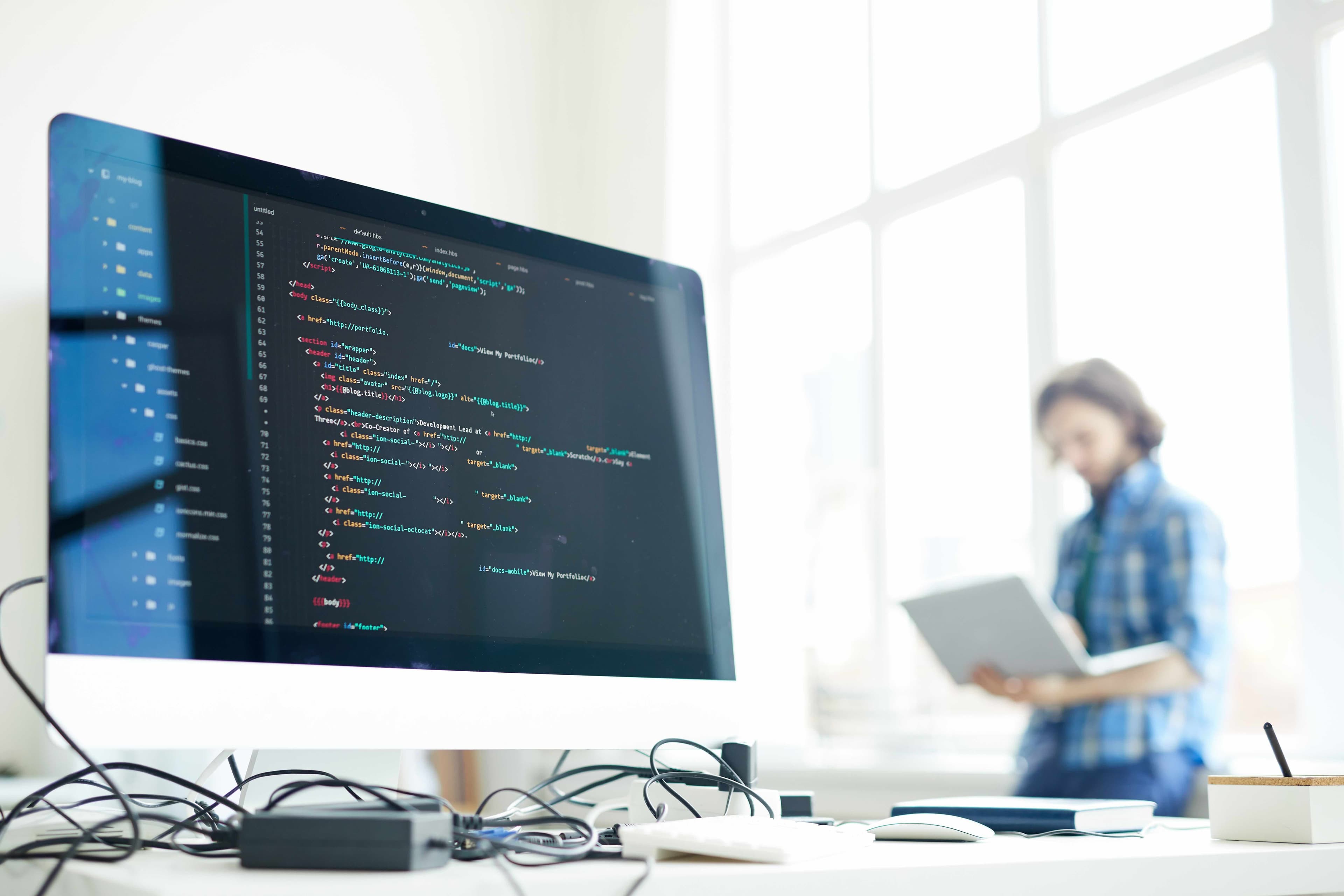 Developer working through component code on a laptop screen