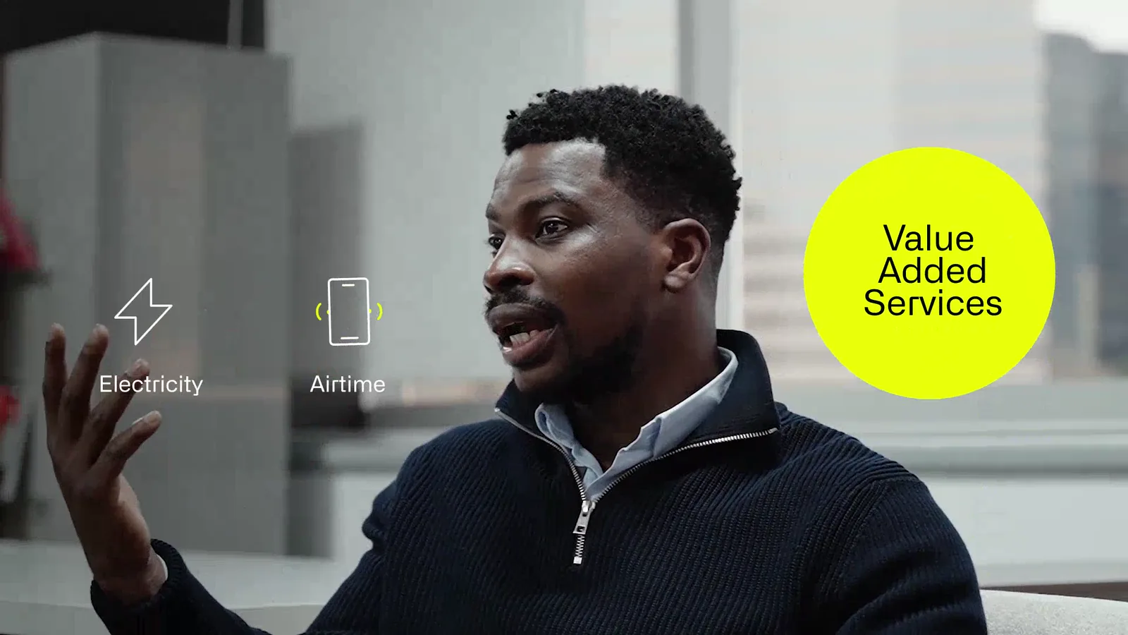 A yellow 'Value Added Services' badge beside outlined electricity and airtime icons, overlaid on a speaker mid-conversation.